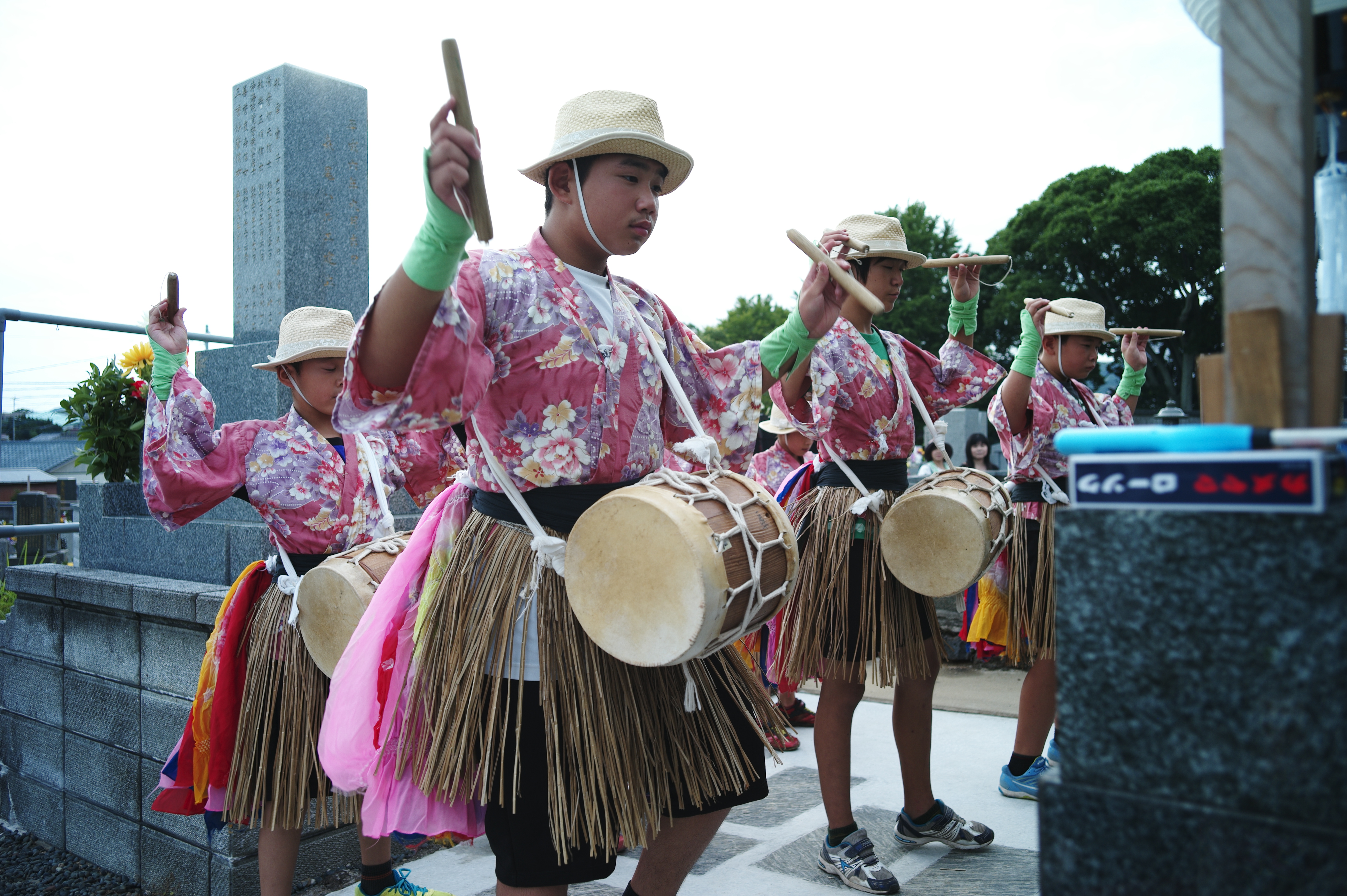 Men in pink shirts at Japanese festival