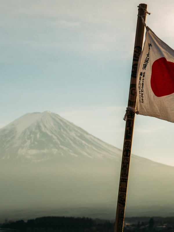 Japanese flag in front of Mt Fuji
