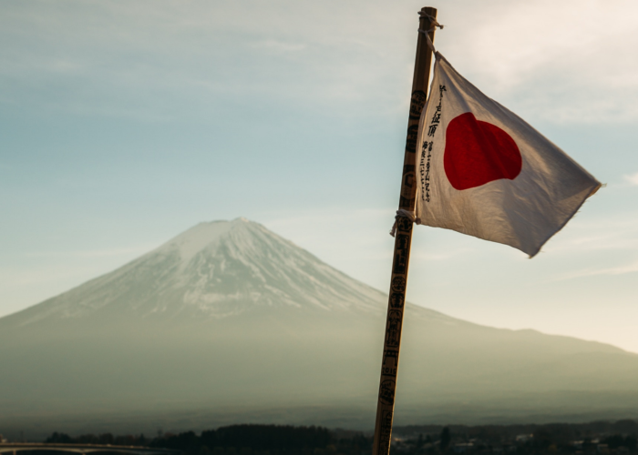 Japanese flag in front of Mt Fuji
