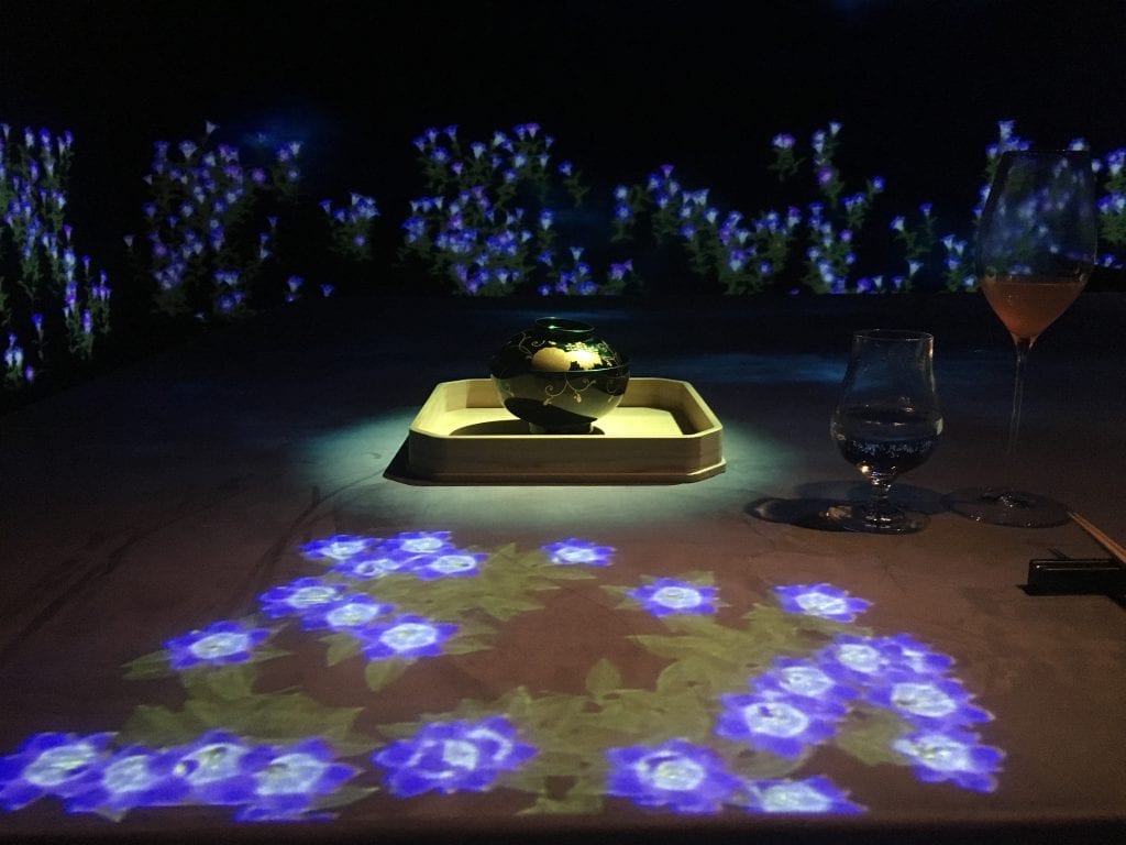 A projection of flowers at Moonflower Sagaya Ginza Teamlab Collaboration