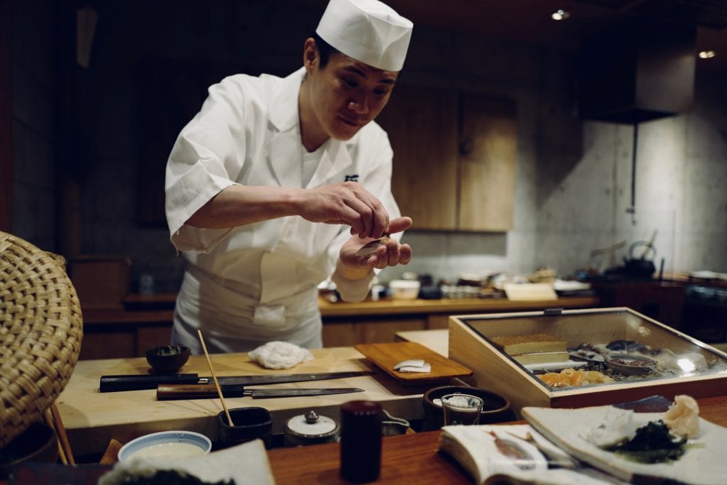 Sushi chef making sushi