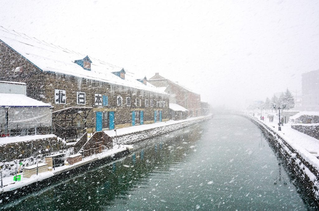 Snow falling over the canal in Otaru.